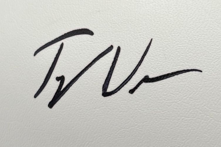 Tyler Warren's bold black ink signature, marked by stylized overlapping letters, appears on an Indianapolis Colts logo football from Sports Integrity. The autograph is large and dynamic, though the text is not easily discernible. Includes a display case.