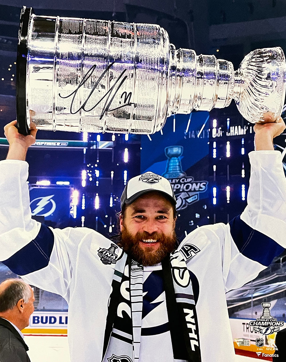 Victor Hedman smiles and lifts the Stanley Cup overhead on the ice in this signed 16x20 Tampa Bay Lightning trophy photo by Sports Integrity.