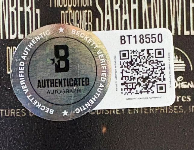 A Beckett Verified Authentic Autograph sticker and QR code label (BT18550) are attached to a black-and-gold Vince Papale Philadelphia Eagles Signed 11x17 Invincible Movie Poster Photo from Sports Integrity.
