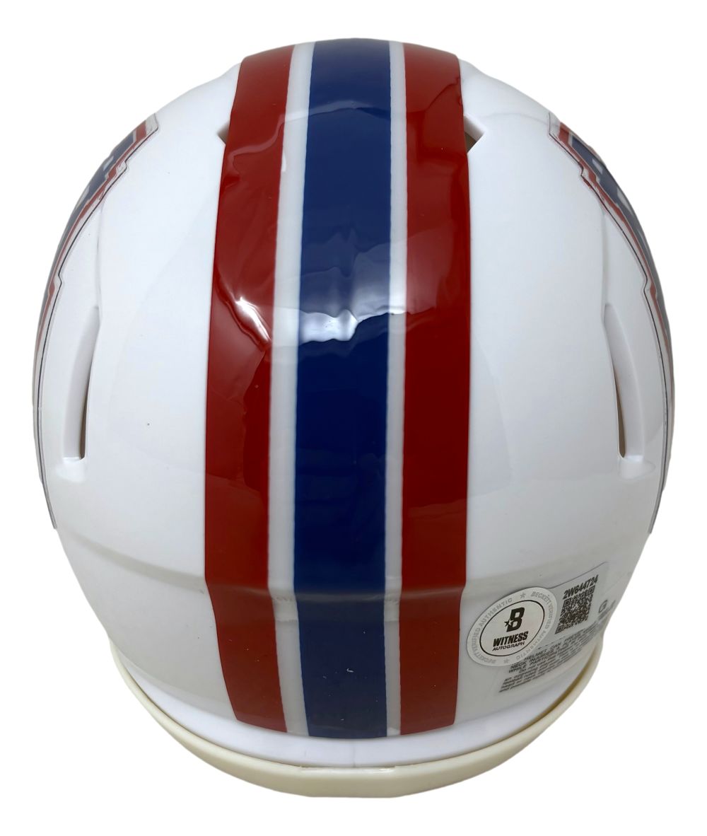 A Warren Moon Signed Houston Oilers Mini Speed Helmet by Sports Integrity, white with a wide blue center stripe flanked by red, viewed from the back and displaying certification stickers on the lower right.