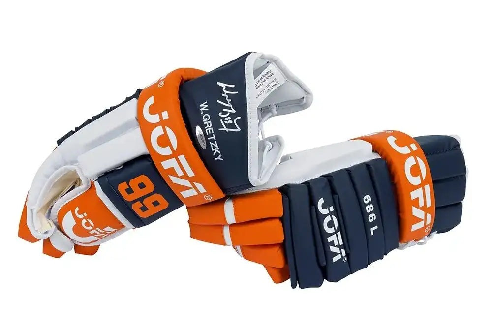 A pair of full size Edmonton Oilers replica Jofa hockey gloves by Sports Integrity, signed by Wayne Gretzky with "99" and "W. Gretzky" signatures visible, and "686 L" printed on one glove.