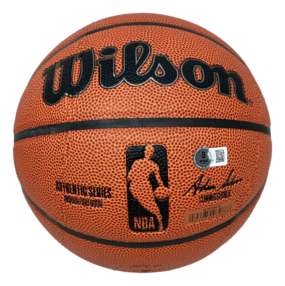 A Sports Integrity Yao Ming Houston Rockets signed Wilson NBA I/O basketball features a textured orange surface, black seams, NBA logo, Wilson in bold black letters, stamped signature, authenticity sticker, barcode, and comes with a case.