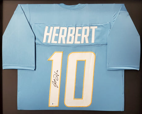Los Angeles Chargers Justin Herbert Autographed Framed Powder Blue Jersey Beckett BAS Stock #191176