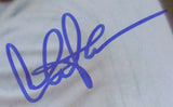 The Sports Integrity Charlie Sheen Signed Framed 11x14 Eight Men Out Oscar Hap Felsch Photo features a large blue stylized signature with bold, overlapping lines and an upward flourish on a white background.