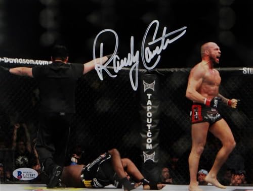 Randy Couture Signed MMA 8x10 Photo With Belt- Beckett Auth *Ref Back Turned