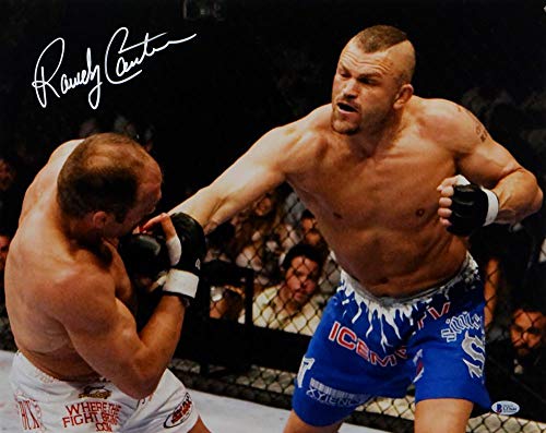 Randy Couture Autographed MMA 16x20 Hit By Liddell Photo- Beckett Auth *White
