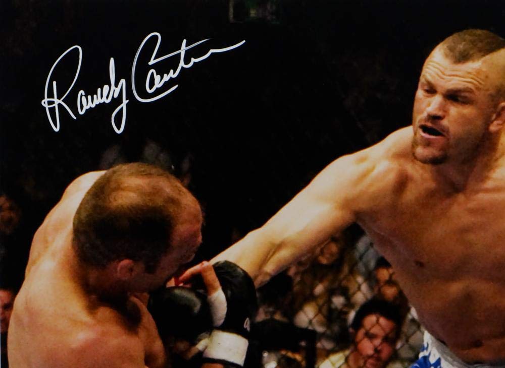 Randy Couture Autographed MMA 16x20 Hit By Liddell Photo- Beckett Auth *White