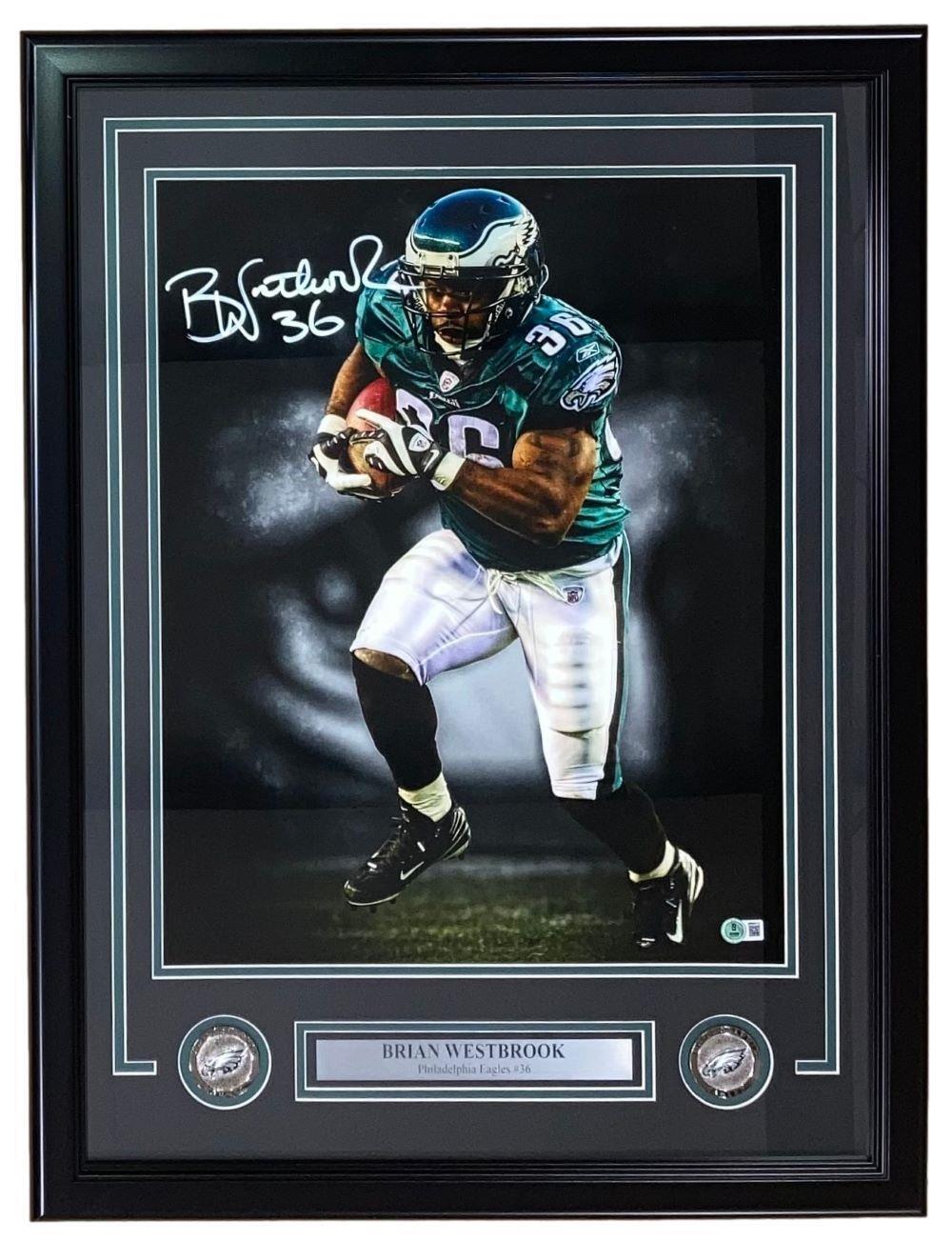 The Sports Integrity Brian Westbrook Signed Framed 16x20 Philadelphia Eagles Photo (BAS) features his autograph, a plaque with his name and team, and two commemorative coins.