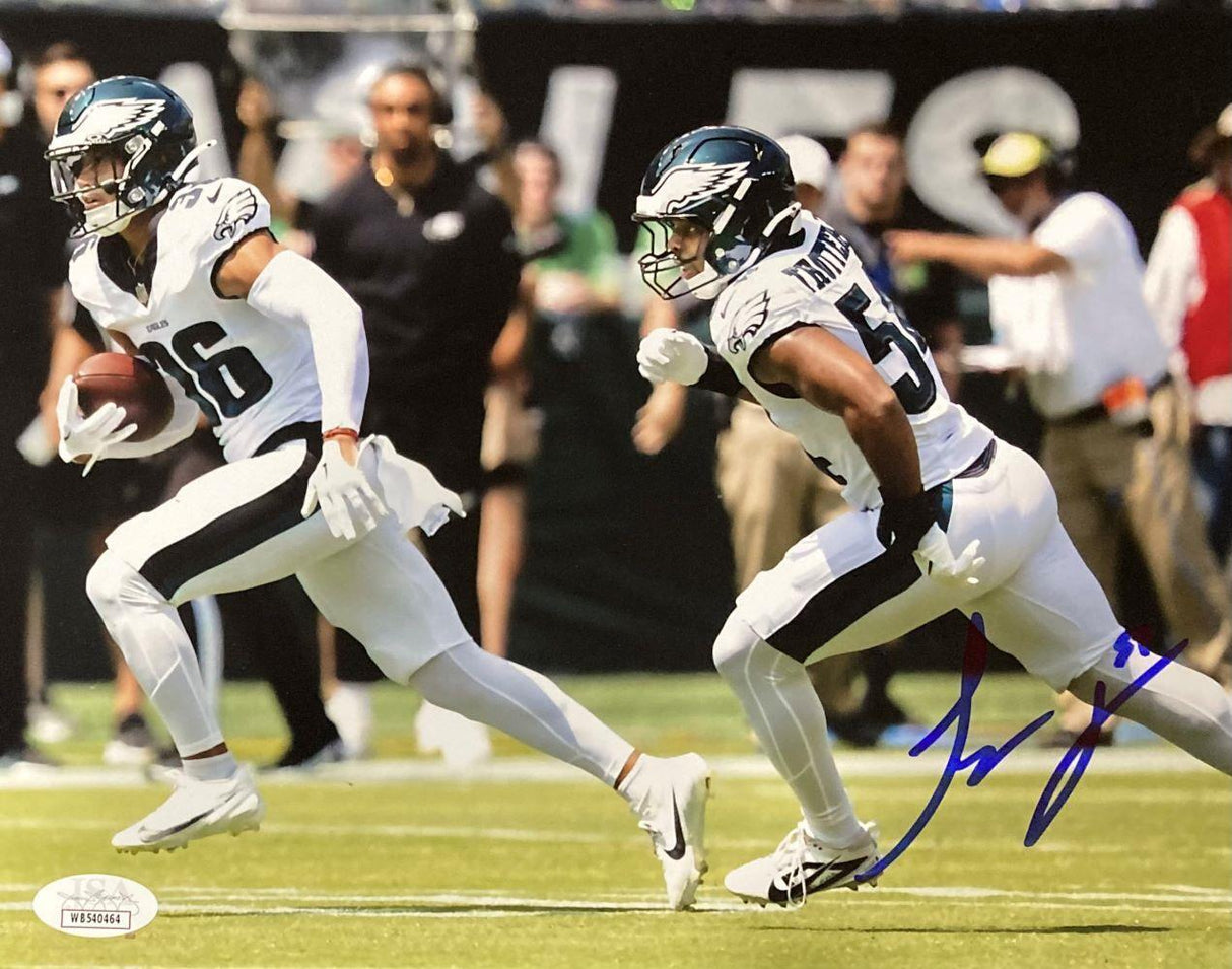 The Sports Integrity Jeremiah Trotter Jr Signed 8x10 Philadelphia Eagles Blocking Photo (JSA) shows two players in white uniforms running on the field, with one carrying the ball and an autograph in blue ink.