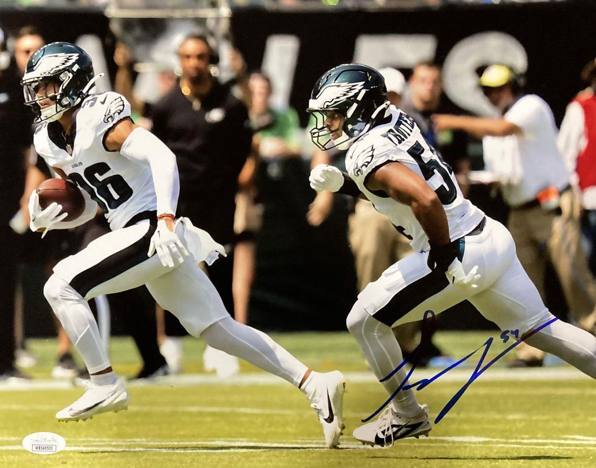 The Sports Integrity Jeremiah Trotter Jr Signed 11x14 Philadelphia Eagles Blocking Photo JSA features two Eagles players in white uniforms running on the field, with one carrying the ball as spectators and staff look on in the blurred background.