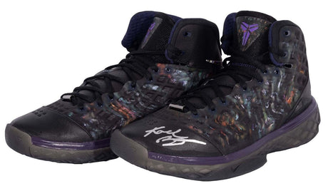A pair of Kobe Bryant Lakers Signed Nike Zoom Kobe III Prelude Shoes by Sports Integrity, featuring translucent sides, purple accents, the Kobe Bryant logo on the tongue, and a white autograph on one toe.