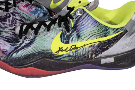Close-up of a Kobe Bryant Lakers Signed Nike Zoom Kobe 8 System Prelude Shoe by Sports Integrity, featuring a bright yellow swoosh, black laces, neon green lining, signature on the side, and a red-to-purple gradient sole.