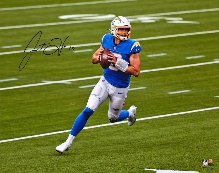 A Justin Herbert Signed 16x20 Los Angeles Chargers Photo by Sports Integrity shows Herbert (#10) in a blue uniform running on the field with a football, autograph at top left, and NFL logo at bottom right.