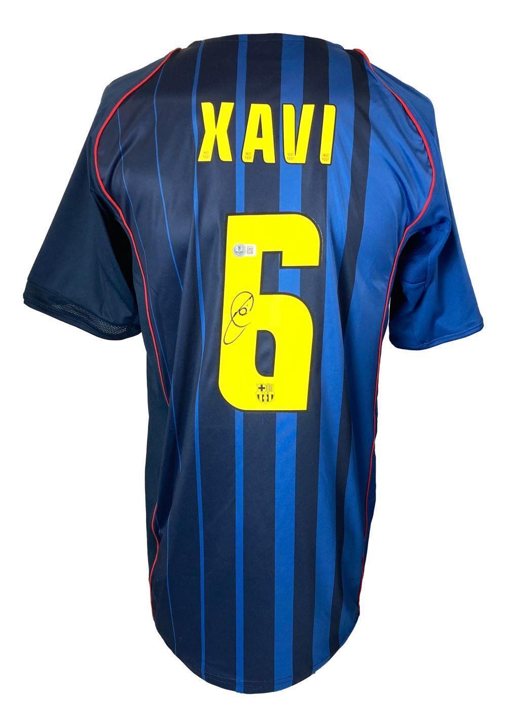 The Sports Integrity Xavi Signed Barcelona Nike Soccer Jersey BAS features blue and black stripes with red trim, XAVI and number 6 in yellow on the back, plus a signature below the number.