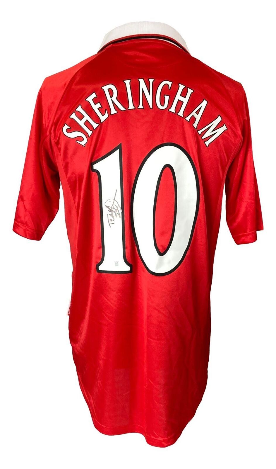 A Manchester United red Umbro soccer jersey by Sports Integrity, featuring SHERINGHAM and number 10 on the back, with Teddy Sherringham’s signature inside the number. BAS authenticated.