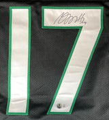 A close-up of the Sports Integrity Davante Adams New York Signed Black Football Jersey BAS shows a green-and-white #17 with a black ink autograph on the 7, plus a small authentication sticker below the number.