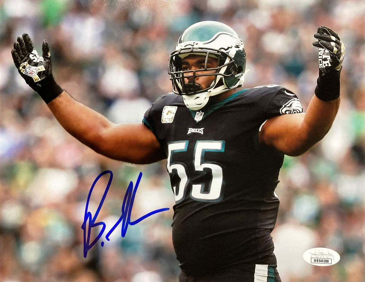 The Sports Integrity Brandon Graham Signed 8x10 Philadelphia Eagles Photo JSA features number 55 in a black uniform on the field, arms raised, with a large blue autograph across the front.