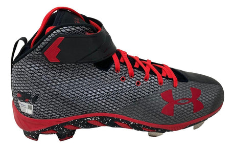 A pair of black and gray Bryce Harper Signed Game Issued Phillies Under Armour cleats by Sports Integrity, featuring red laces, red logo, high-top design, ankle strap, textured pattern, speckled sole, and metal-tipped studs.
