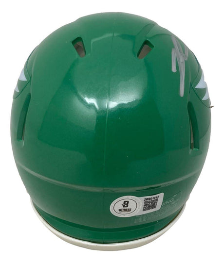A Kelly green Philadelphia Eagles mini speed helmet by Sports Integrity, featuring Jalen Carter's autograph, a rear white sticker with QR code and letter B.