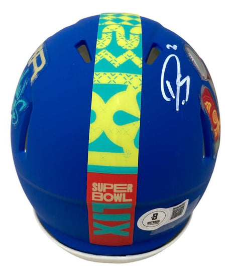 The Sports Integrity Darius Slay Signed Eagles Super Bowl LIX Mini Speed Helmet BAS features a blue design, yellow and green stripe, white autograph on the left, bold graphics, and several stickers displayed from the back.