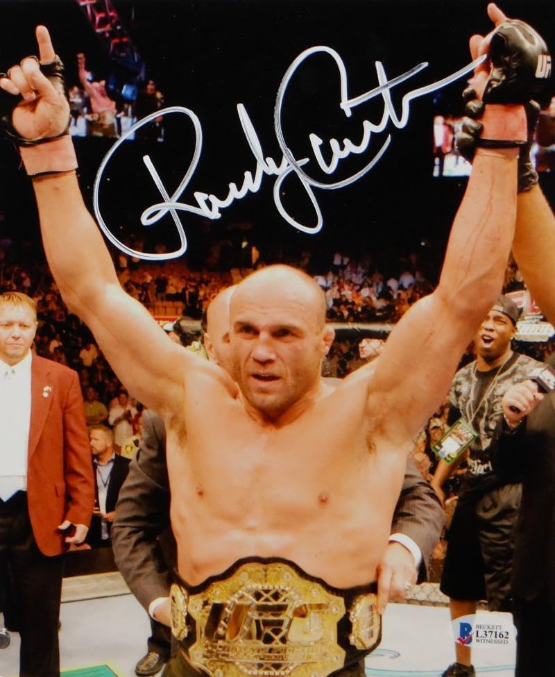 Randy Couture Autographed MMA 8x10 Photo With Belt- Beckett Auth *White