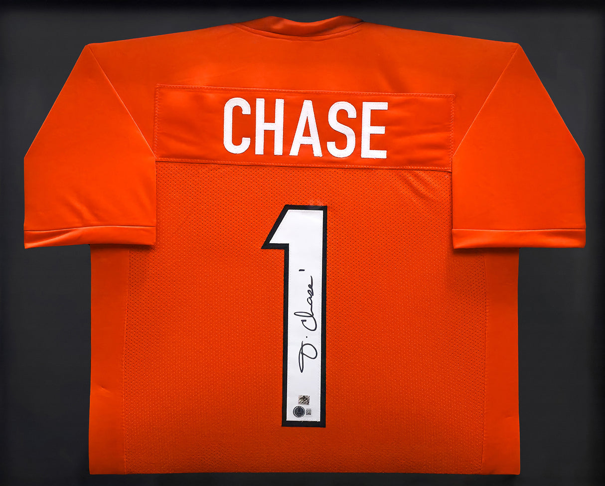 Cincinnati Bengals Ja'Marr Chase Autographed Framed Orange Jersey Beckett BAS Witness Stock #239062