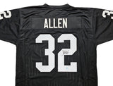 Oakland Raiders Marcus Allen Autographed Black Jersey Beckett BAS Witness Stock #215325