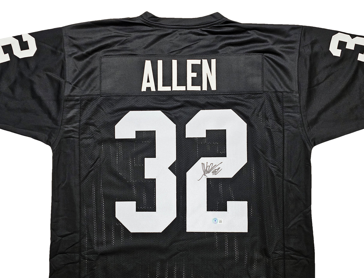 Oakland Raiders Marcus Allen Autographed Black Jersey Beckett BAS Witness Stock #215325