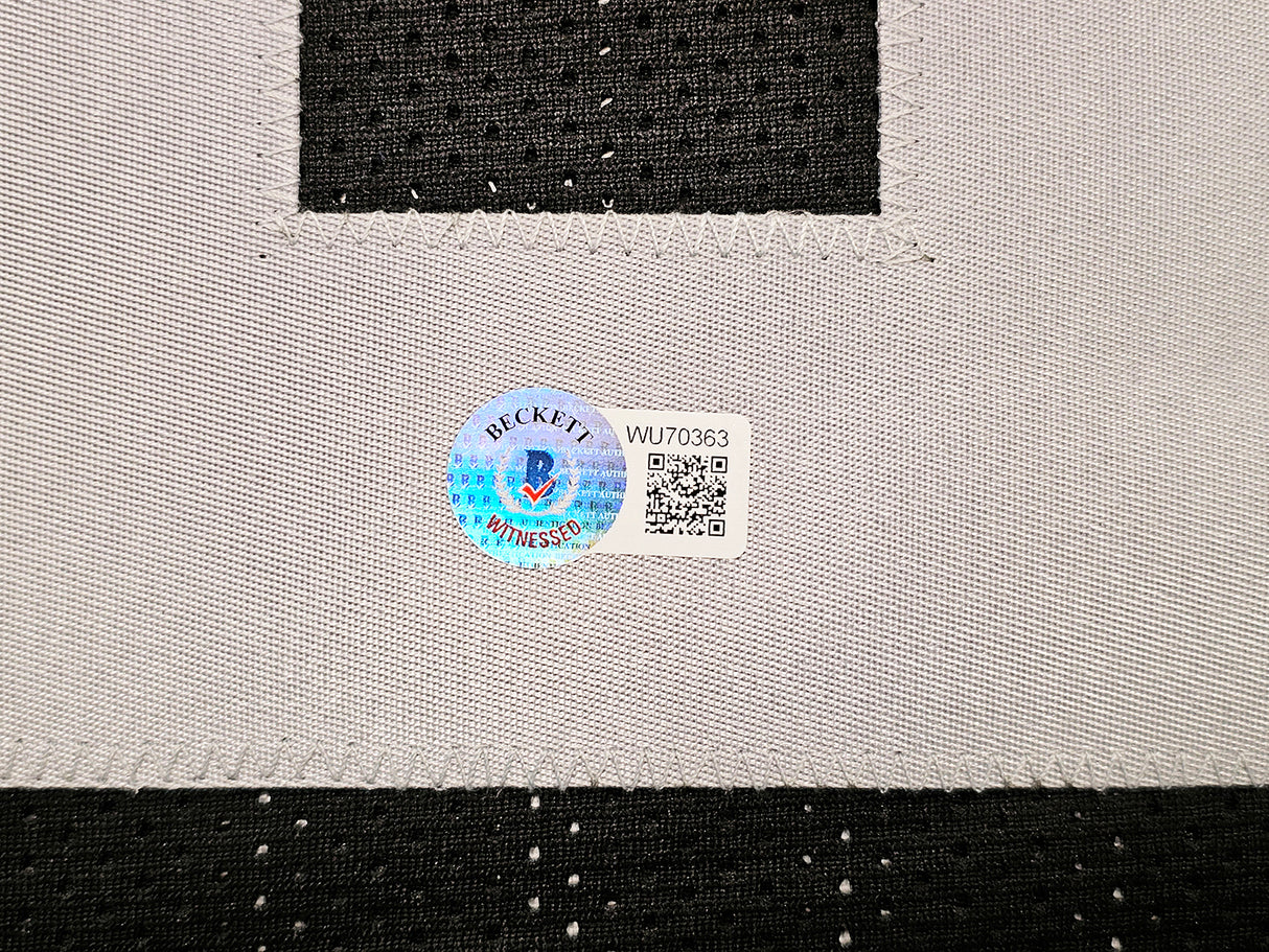 Oakland Raiders Marcus Allen Autographed Black Jersey Beckett BAS Witness Stock #215325