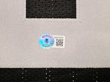 Oakland Raiders Marcus Allen Autographed Black Jersey Beckett BAS Witness Stock #215325
