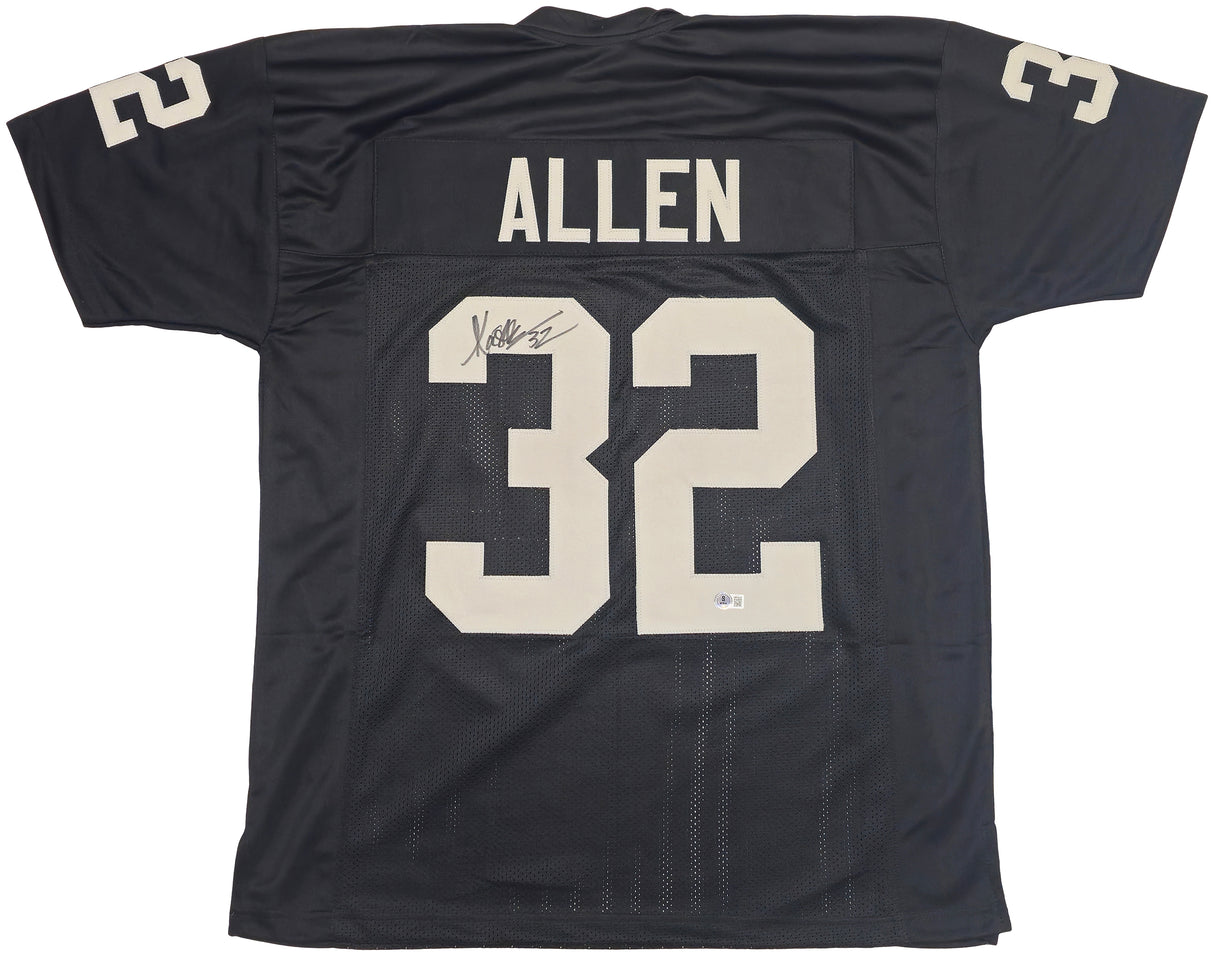 Oakland Raiders Marcus Allen Autographed Black Jersey Beckett BAS Witness Stock #230004