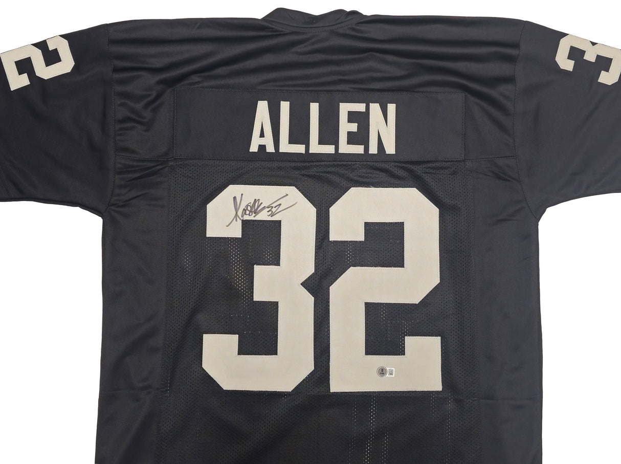 Oakland Raiders Marcus Allen Autographed Black Jersey Beckett BAS Witness Stock #230004