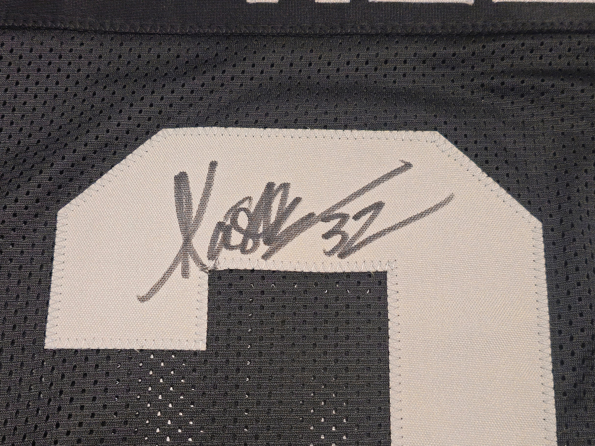 Oakland Raiders Marcus Allen Autographed Black Jersey Beckett BAS Witness Stock #230004