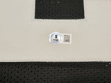 Oakland Raiders Marcus Allen Autographed Black Jersey Beckett BAS Witness Stock #230004