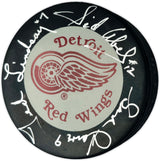 Gordie Howe, Sid Abel, & Ted Lindsay Autographed Official Detroit Red Wings Logo Hockey Puck Production Line Beckett BAS #AE85127