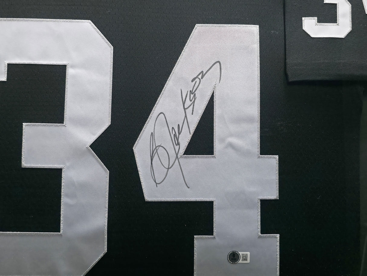 Oakland Raiders Bo Jackson Autographed Framed Black Jersey (Dent) Beckett BAS Witness #1W615199