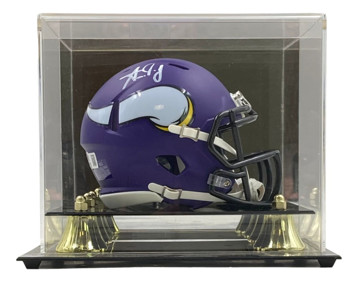 The Sports Integrity Aaron Jones Signed Minnesota Vikings Mini Speed Helmet is showcased in a BAS-authenticated case with a black base and gold supports.