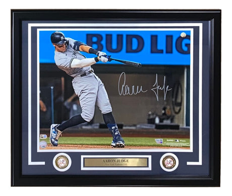 The Aaron Judge Signed Framed 16x20 New York Yankees Home Run 62 Photo by Sports Integrity features Judge swinging a bat, two medallions, and a nameplate reading AARON JUDGE, with a Bud Light sign visible in the background.