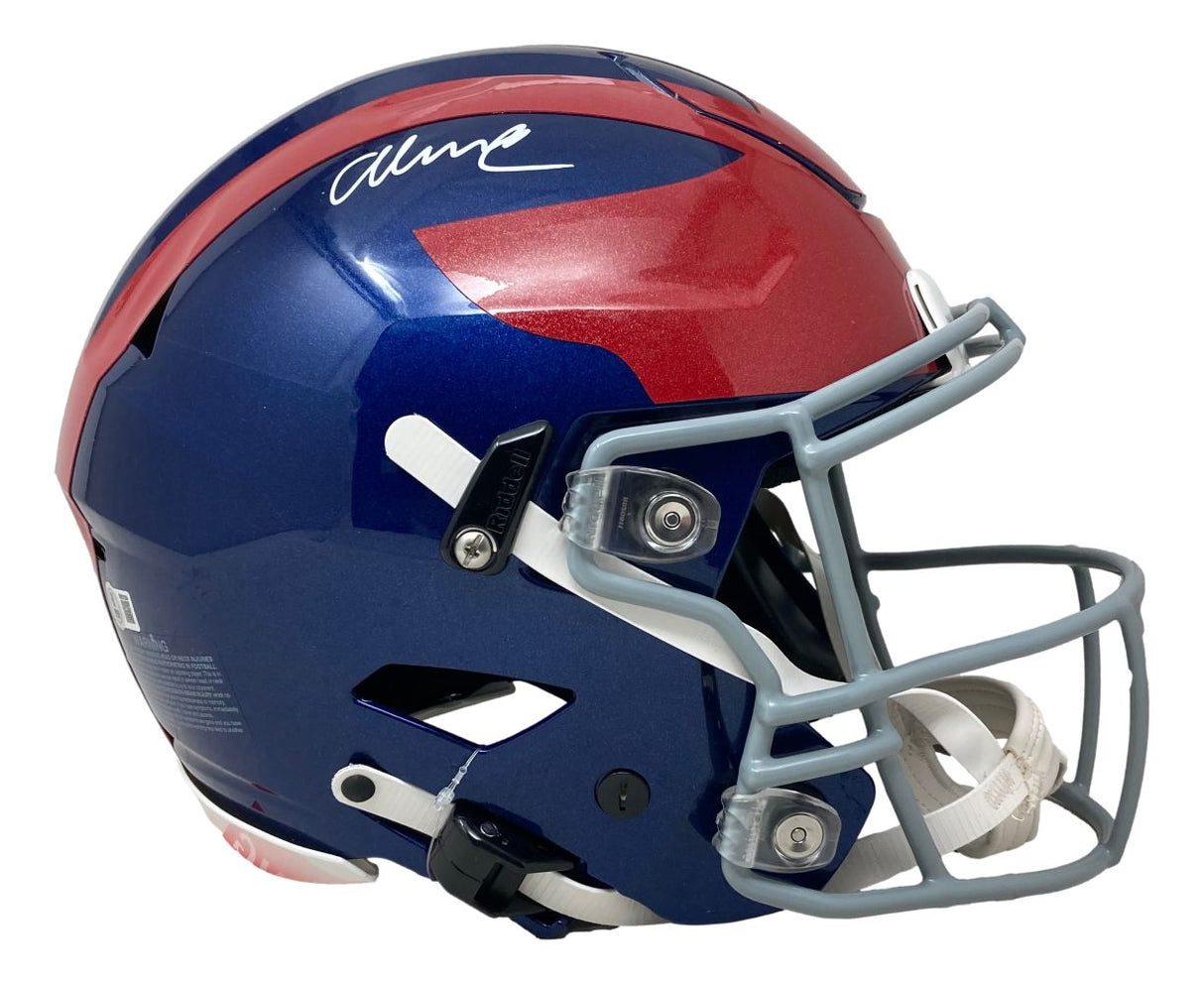 The Sports Integrity Abdul Carter Signed Giants Full Size Alternate Authentic SpeedFlex Helmet BAS features a blue shell with a red stripe, large red "7" on the side, white signature on top, and gray facemask, shown from the right side.