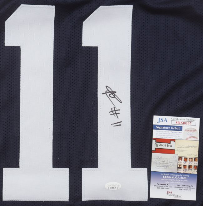 The Abdul Carter Penn State Signed Navy Blue Football Jersey by Sports Integrity features a large white number 11, an autograph in black marker, and comes with two authentication certificates, including a JSA with barcode and serial number.