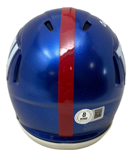 The Sports Integrity Abdul Carter Signed New York Giants Mini Speed Helmet BAS w/ Case is blue, with a single red center stripe, ventilation slots, and a certification sticker near the bottom edge.