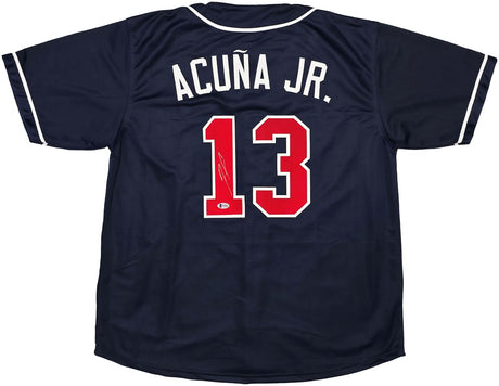 The Sports Integrity Ronald Acuna Jr Atlanta Signed Navy Blue Baseball Jersey BAS features white trim, ACUÑA JR. in white letters, and a large red number 13 on the back.