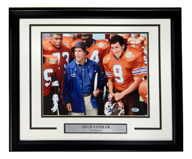 Sports Integrity Adam Sandler Signed Framed 11x14 Photo from The Waterboy (PSA/DNA AP50194), featuring two men in orange football uniforms and one man in a blue jacket and cap on a football field.