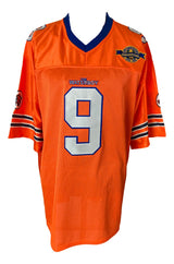 The Sports Integrity Adam Sandler Signed The Waterboy Bobby Boucher Jersey (BAS BF15068) is a bright orange football jersey with blue and white trim, number 9 on the front, and multiple patches including "The Waterboy" on the left chest.