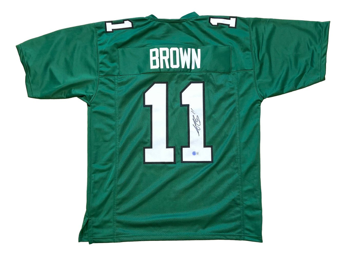 AJ Brown Philadelphia Kelly Green football jersey by Sports Integrity, features "BROWN" and number 11 on the back with an autograph on one digit. BAS authenticated.