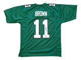 AJ Brown Philadelphia Kelly Green football jersey by Sports Integrity, features "BROWN" and number 11 on the back with an autograph on one digit. BAS authenticated.