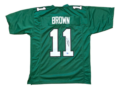 AJ Brown Philadelphia Kelly Green football jersey by Sports Integrity, features "BROWN" and number 11 on the back with an autograph on one digit. BAS authenticated.