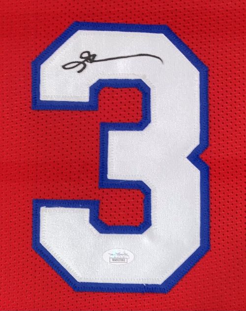 The Allen Iverson Philadelphia Signed Framed Red Basketball Jersey by Sports Integrity features a large white number 3 outlined in blue, with Iverson's autograph on the top left and a JSA authentication sticker at the bottom.