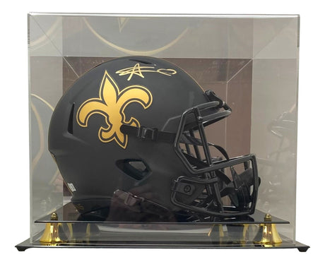 The Sports Integrity Alvin Kamara Signed NO Saints FS Eclipse Replica Speed Helmet, featuring a gold Saints fleur-de-lis logo, comes in a clear case with gold accents.