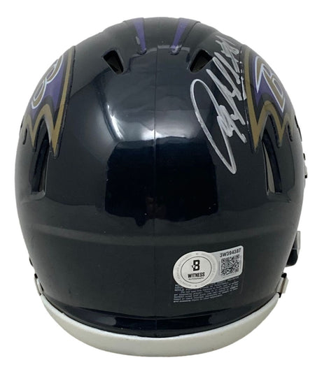 A Sports Integrity Baltimore Ravens mini speed helmet, signed by Anquan Boldin in silver, features BAS authentication and autographs on the top and sides.